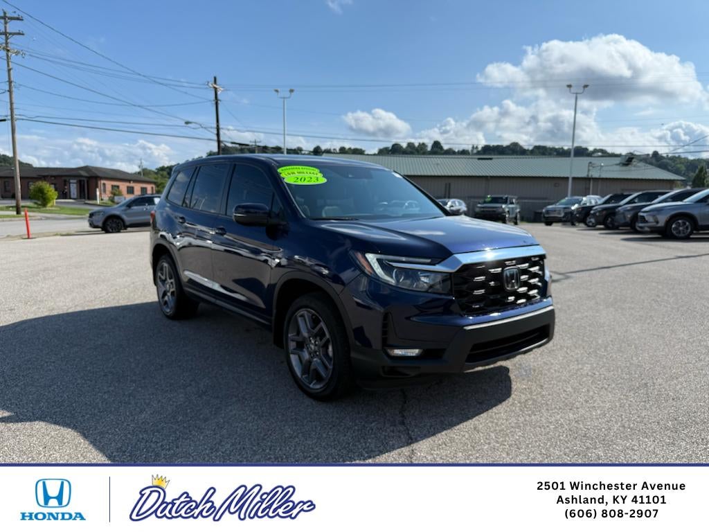 2023 Honda Passport EX-L in Obsidian Blue Pearl — front three-quarter view